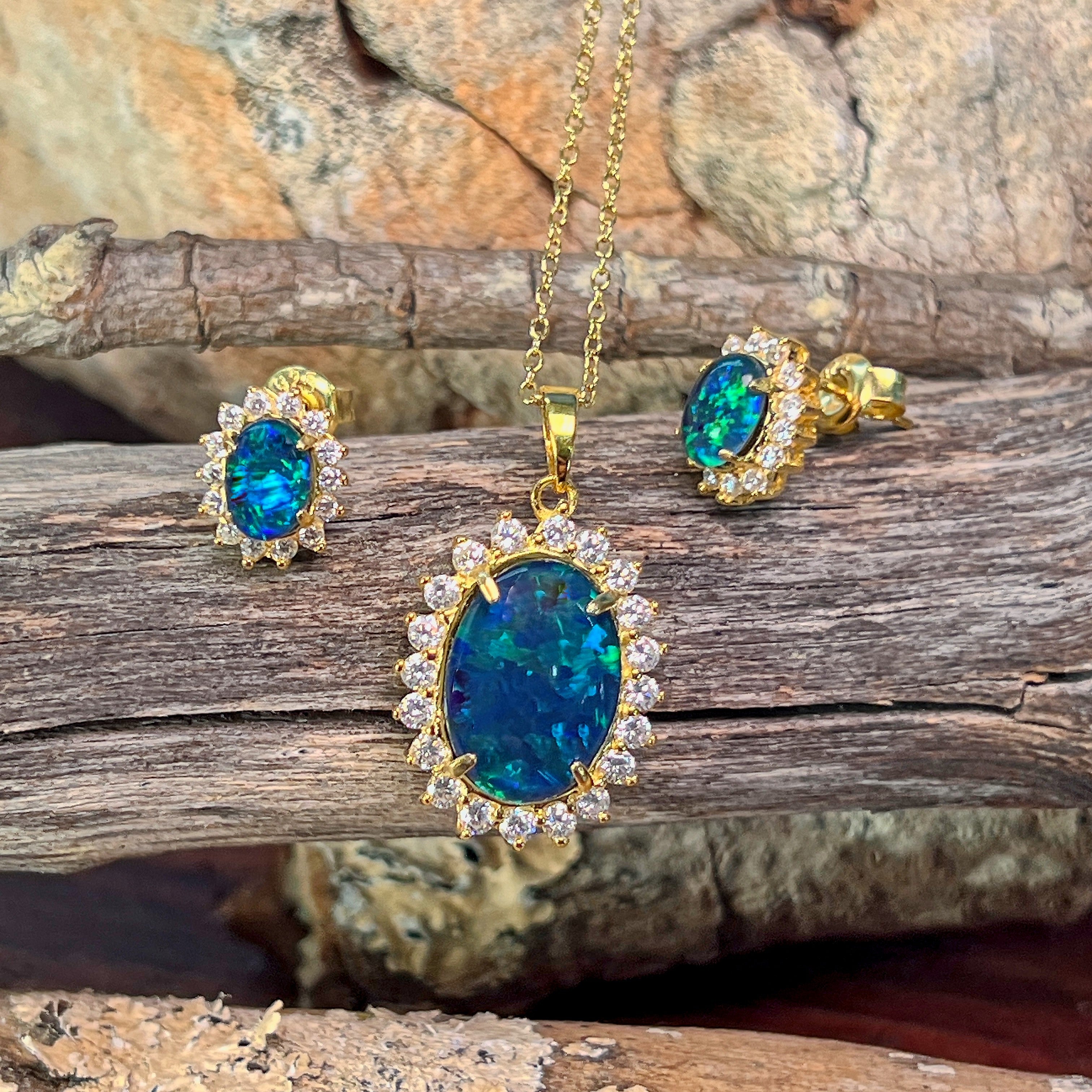 14x10mm oval opal triplet halo pendant with deep blue play-of-colour and matching earrings