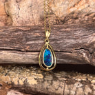 blue and green play-of-colour in an 11.5 x 5.5mm freeform Australian opal doublet pendant