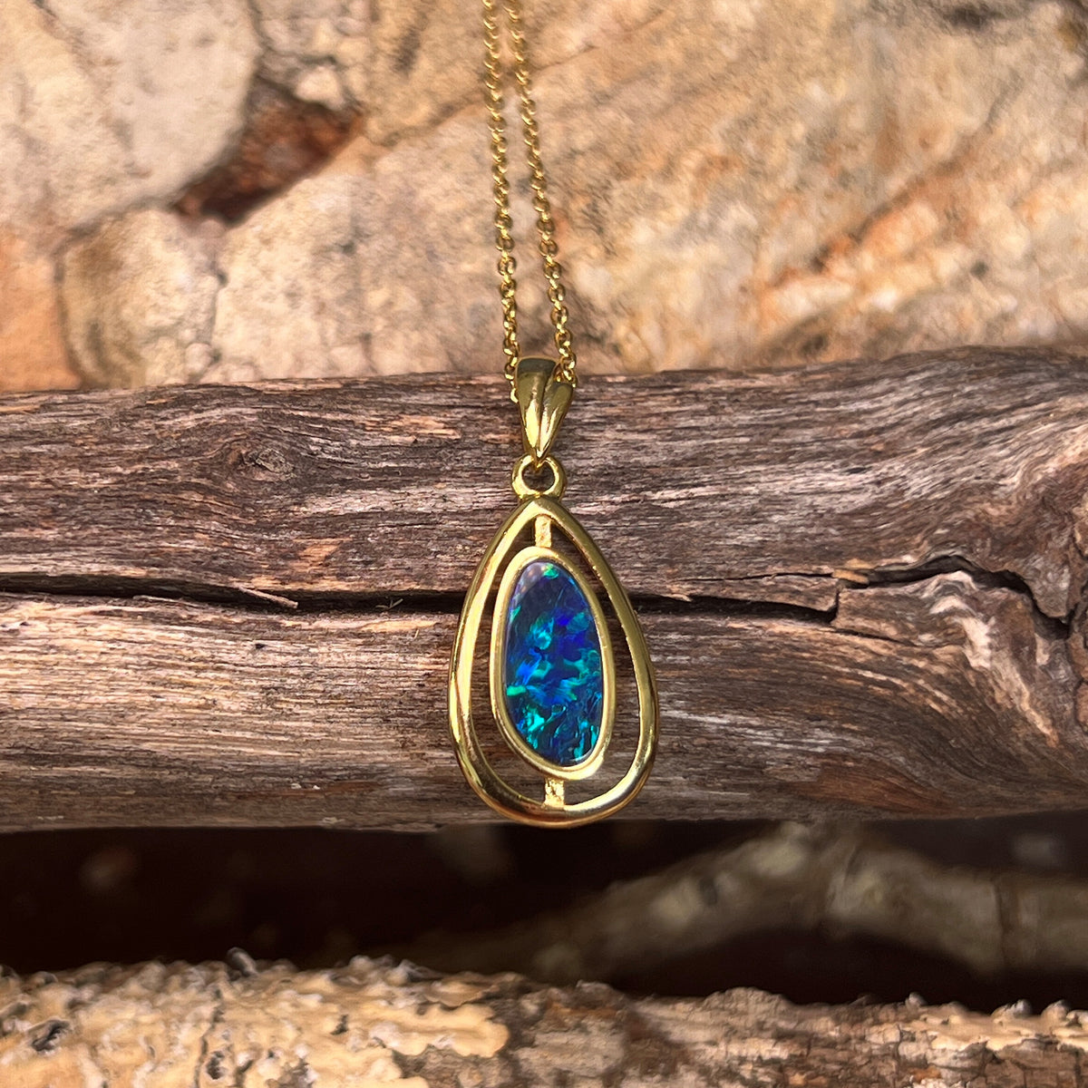 11.5 x 5.5mm Australian opal doublet pendant in yellow gold-plated silver, blue and green