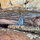 15 x 7mm Australian opal doublet pendant in yellow gold-plated silver, blue, red and yellow