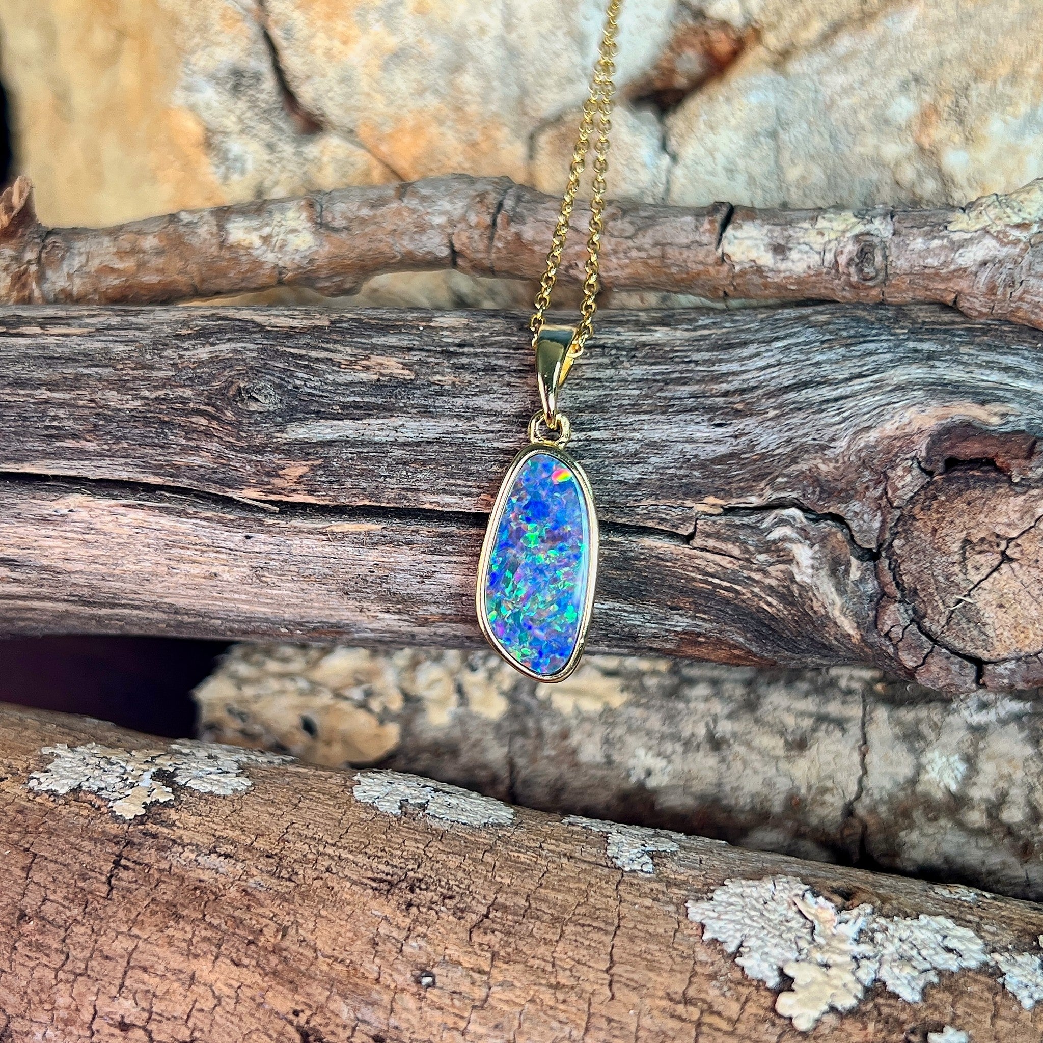 15 x 7mm Australian opal doublet pendant in yellow gold-plated silver, blue, red and yellow