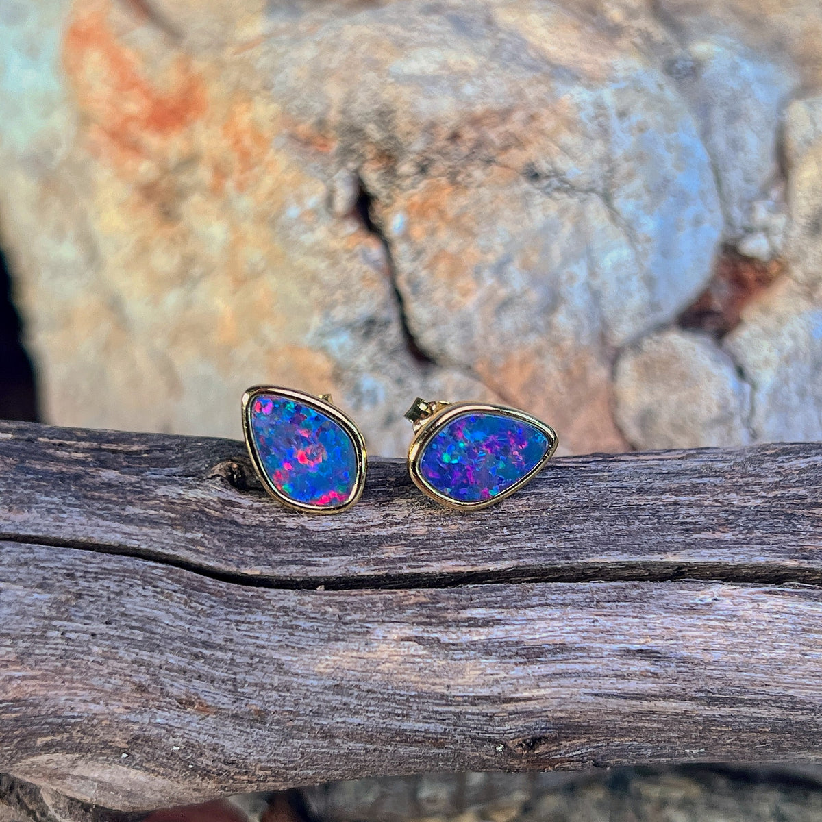 freeform Australian opal doublet earrings in yellow gold-plated silver, red, blue and green play-of-colour