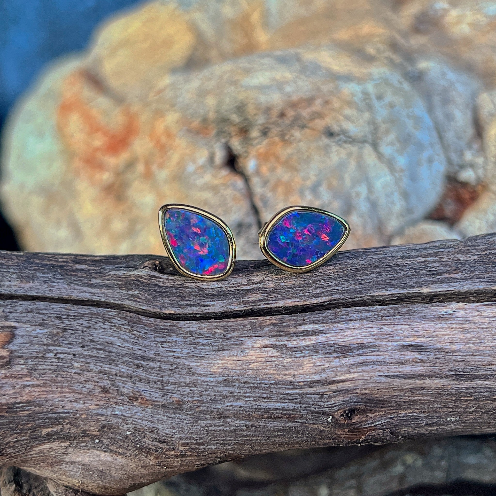 11 x 7.5mm Australian opal doublet earrings in yellow gold-plated silver, red, blue and green