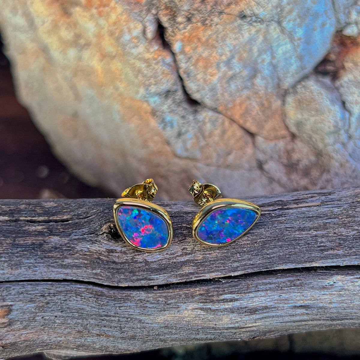 Australian opal doublet earrings, yellow gold-plated silver, 11 x 7.5mm stones showing red, blue and green