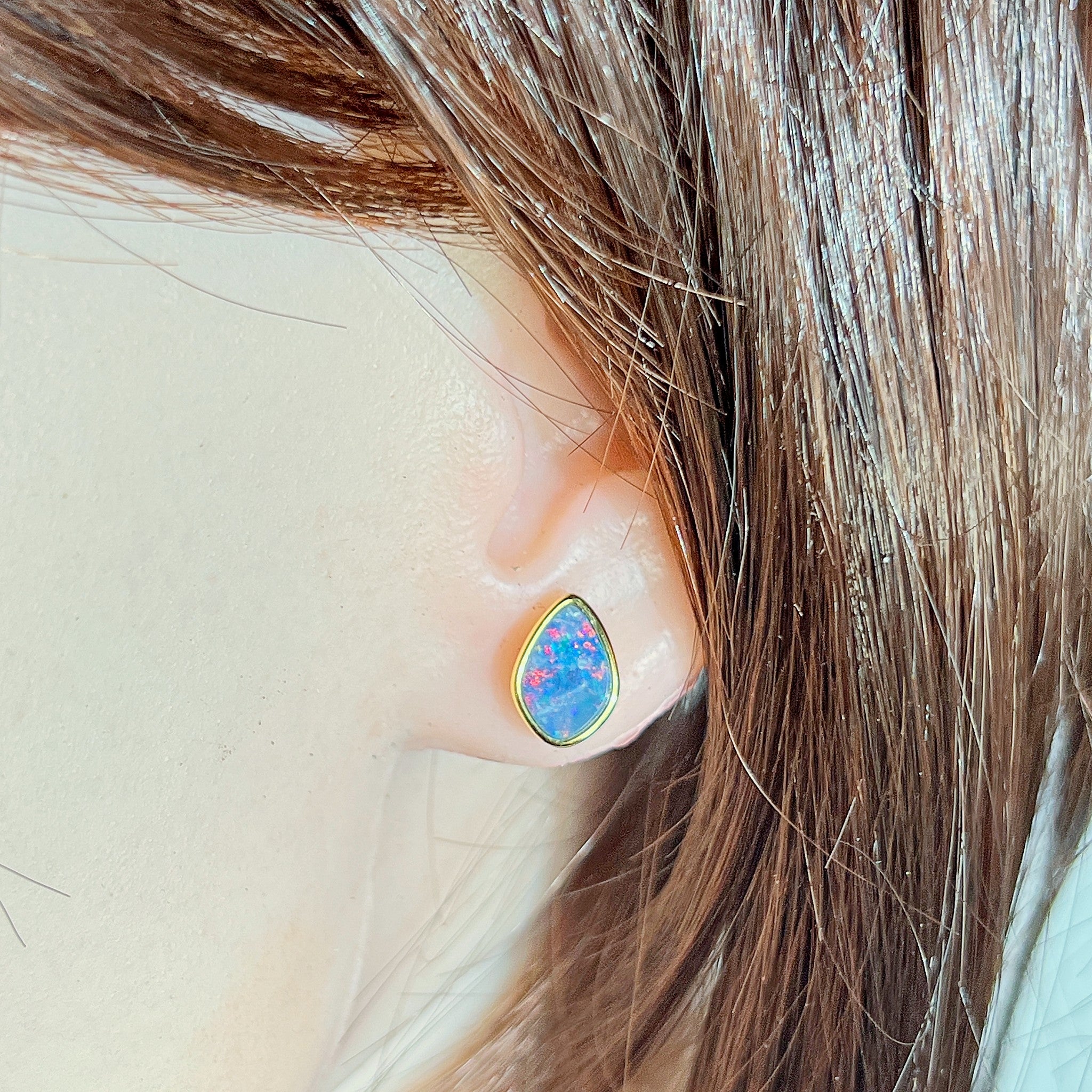Australian opal doublet earrings worn on the ear, yellow gold-plated silver, 11 x 7.5mm freeform stones