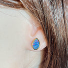red, blue and green Australian opal doublet earrings worn on the ear, yellow gold-plated silver, 11 x 7.5mm