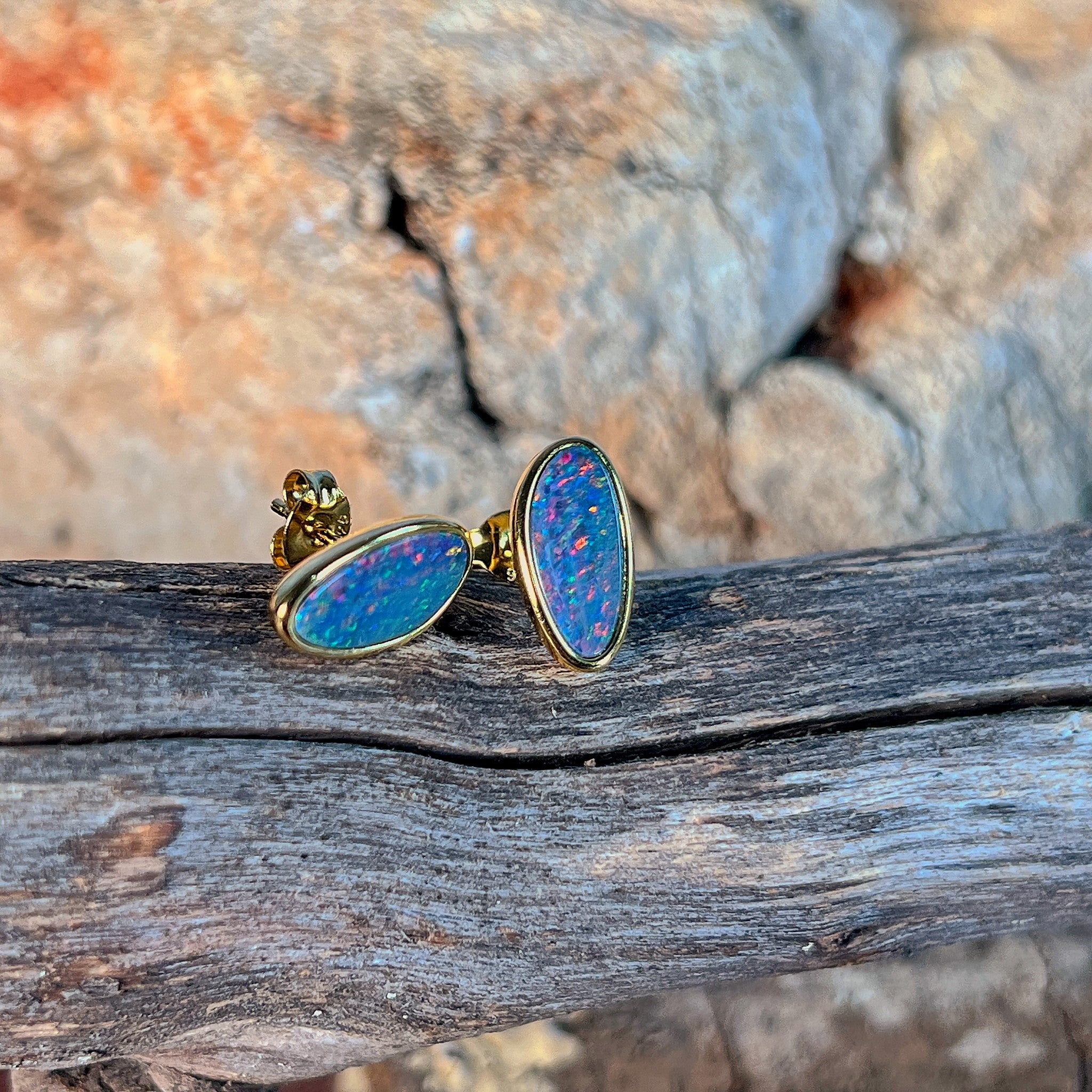 Australian opal doublet earrings, yellow gold-plated silver, 12 x 6mm stones showing red, blue and green