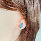 12 x 6mm freeform Australian opal doublet earrings worn on the ear, yellow gold-plated silver
