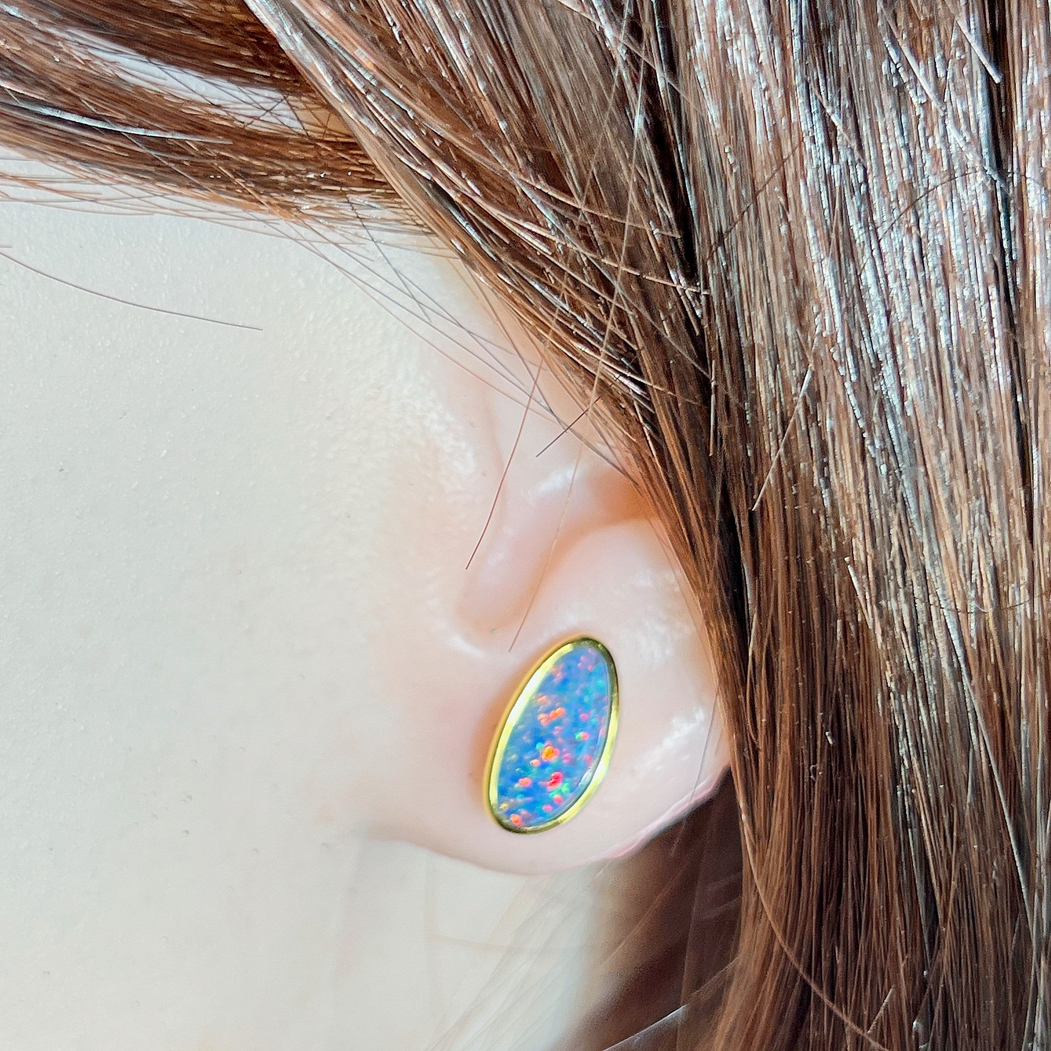 Australian opal doublet earrings worn on the ear, yellow gold-plated silver, 12 x 6mm freeform stones