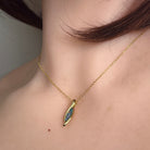 Worn Australian opal doublet pendant in yellow gold-plated silver, blue and green, 12 x 4mm