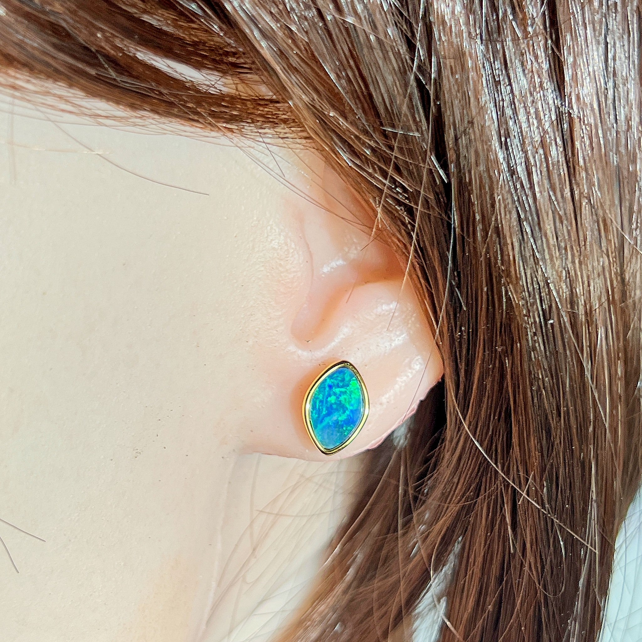 marquise Australian opal doublet earrings in yellow gold-plated silver, worn on the ear