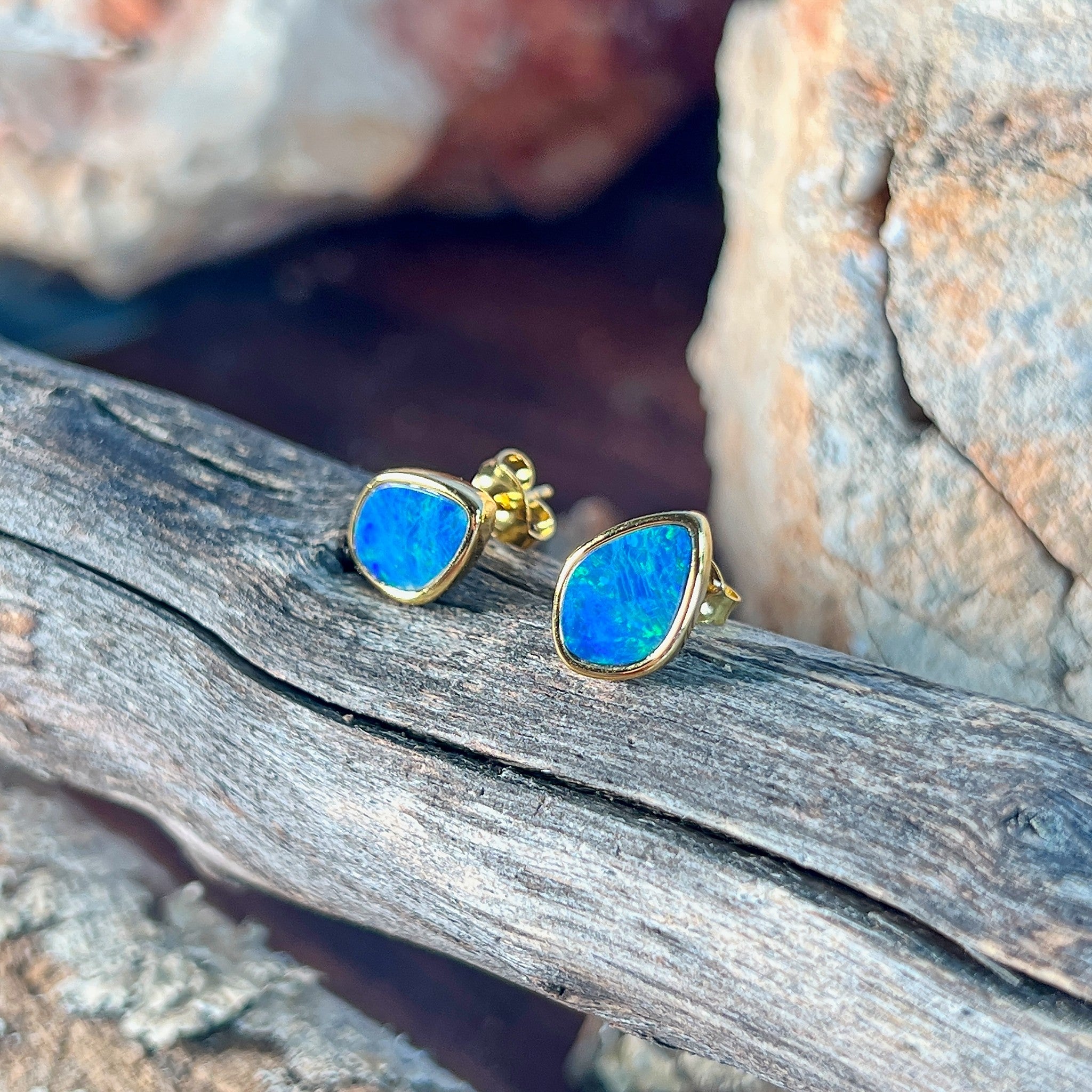 11 x 7.5mm Australian opal doublet earrings in yellow gold-plated silver, green and blue