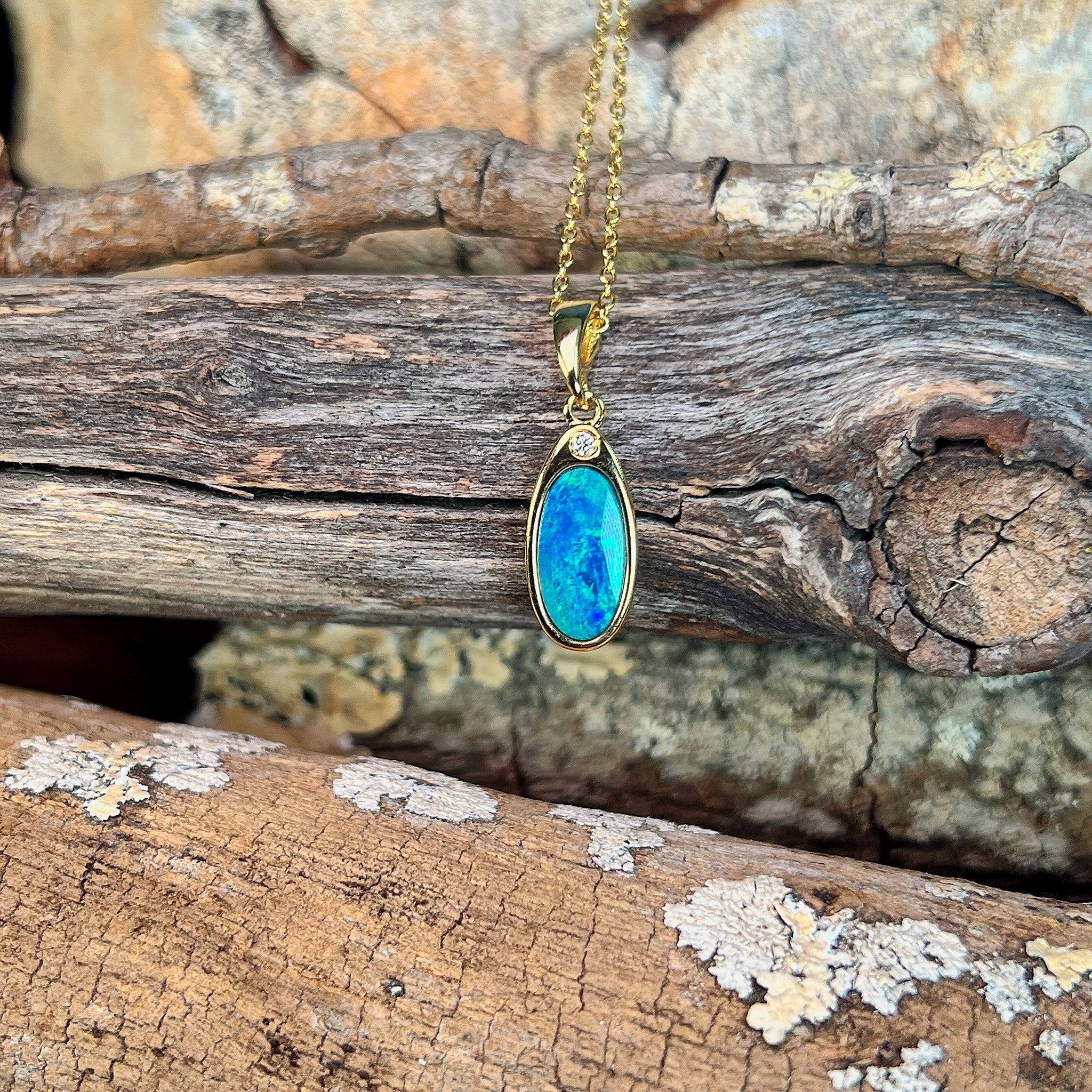 oval Australian opal doublet pendant in yellow gold-plated silver, blue and green play-of-colour