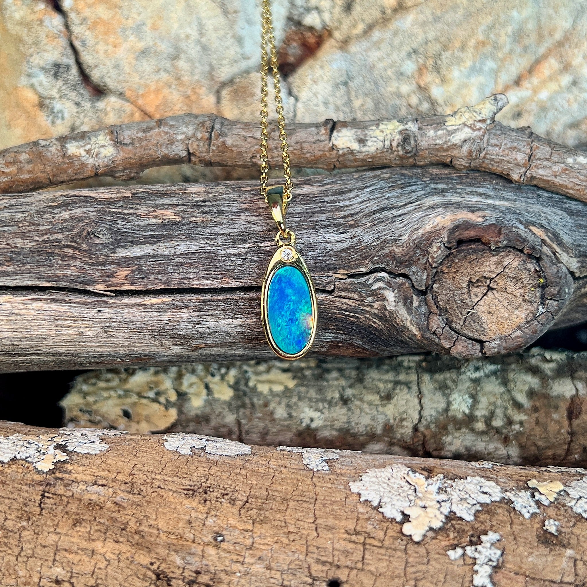 12 x 6.5mm Australian opal doublet pendant in yellow gold-plated silver, blue and green