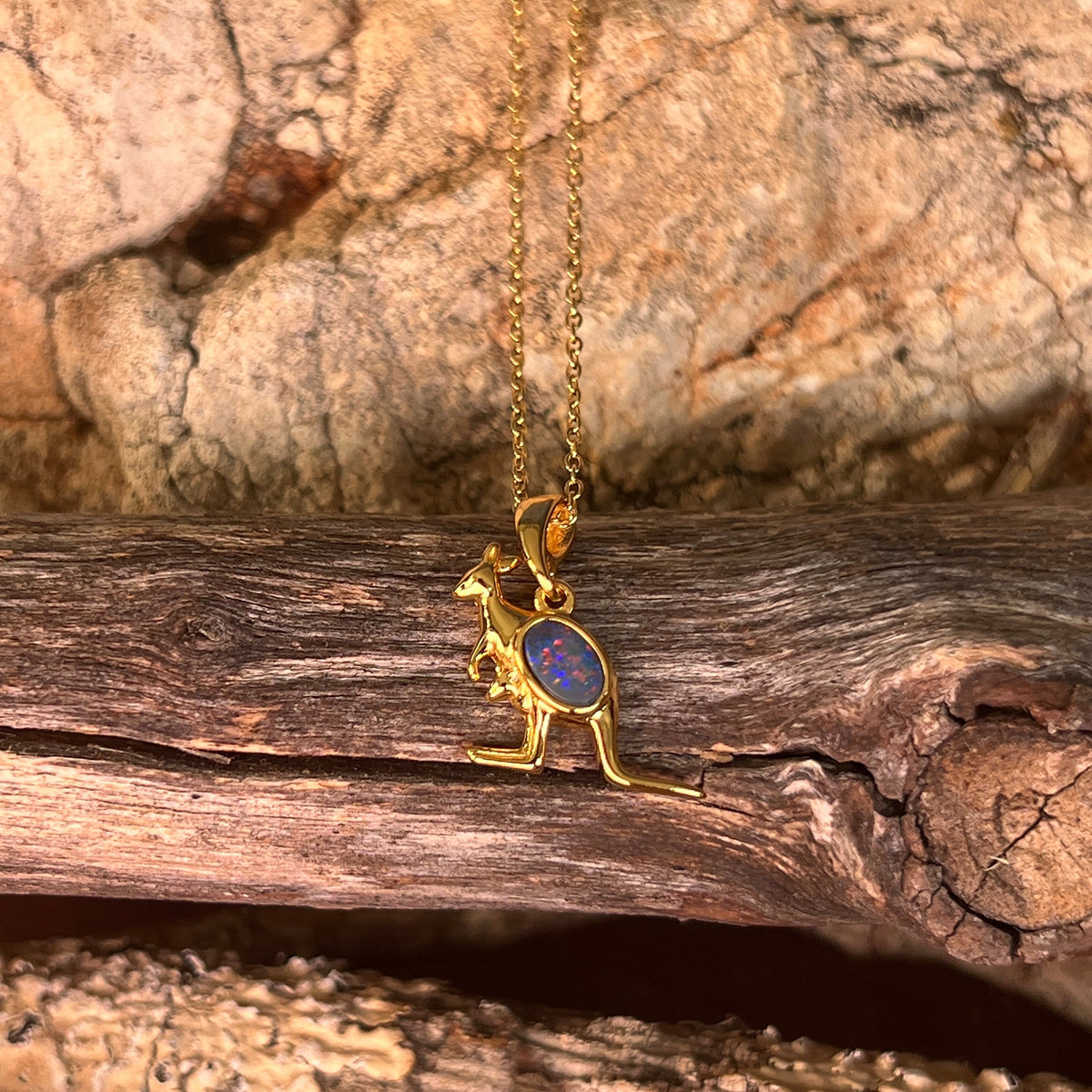 oval Australian opal doublet pendant in yellow gold-plated silver, red, blue and yellow play-of-colour