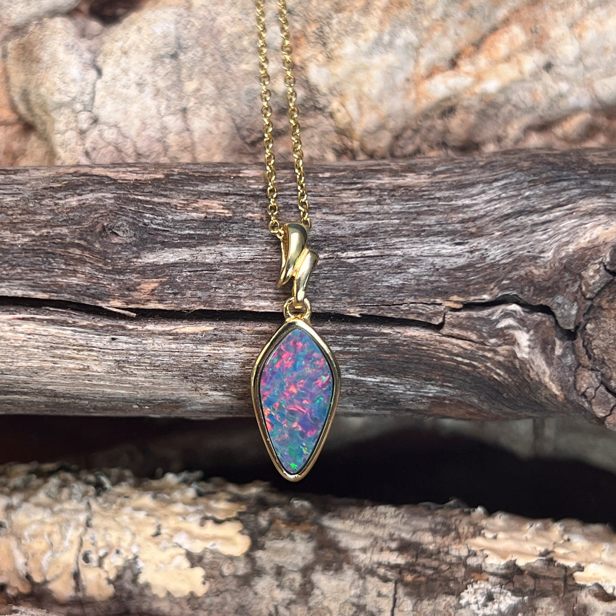 16 x 8mm Australian opal doublet pendant in yellow gold-plated silver, red, blue and green
