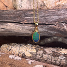 oval Australian opal doublet pendant in yellow gold-plated silver, blue and green play-of-colour