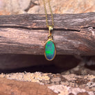 12 x 6mm Australian opal doublet pendant in yellow gold-plated silver, blue and green