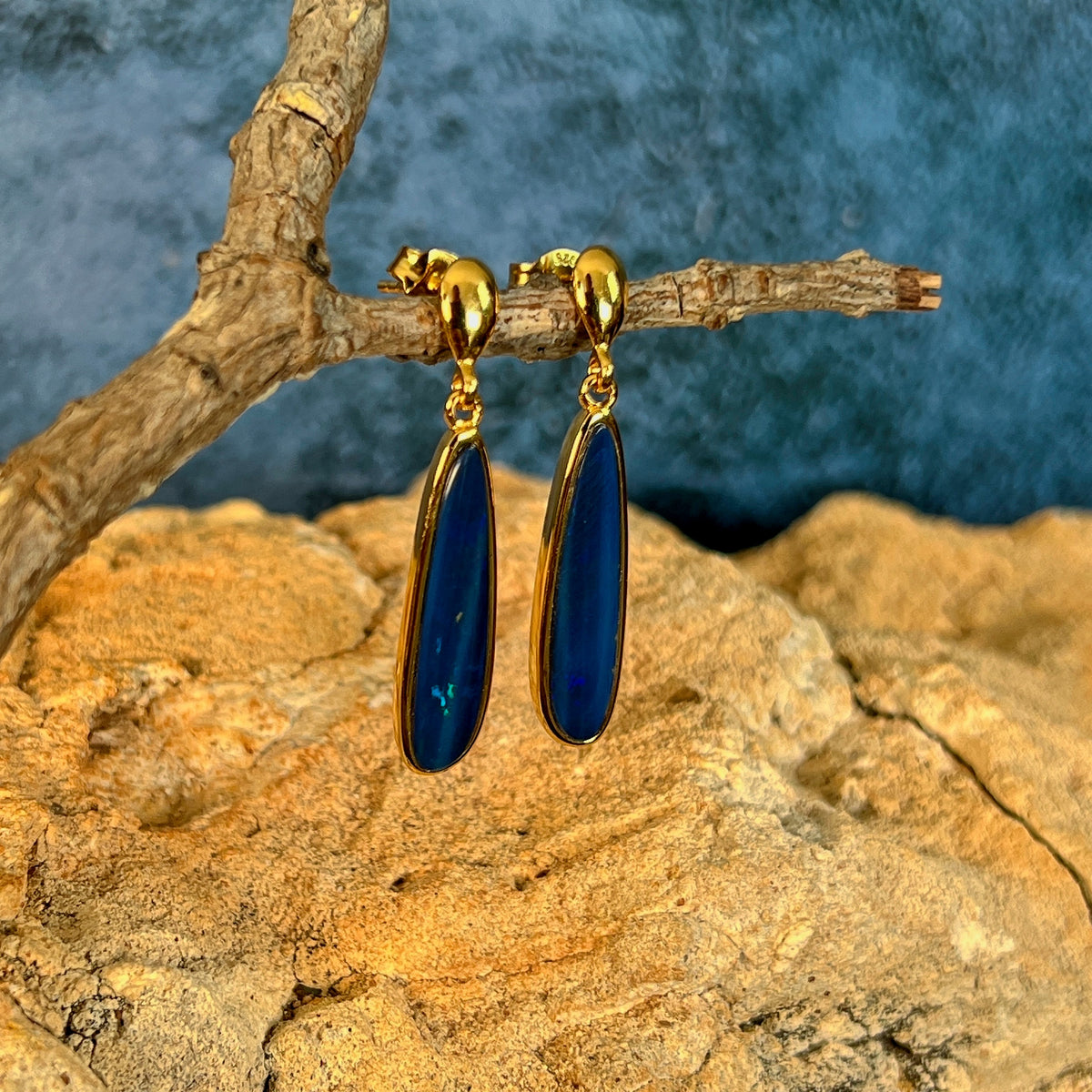 green and blue play-of-colour in 22 x 5.5mm pear-shaped Australian opal doublet earrings