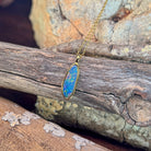 blue, red and yellow play-of-colour in a 17 x 6mm pear-shaped Australian opal doublet pendant
