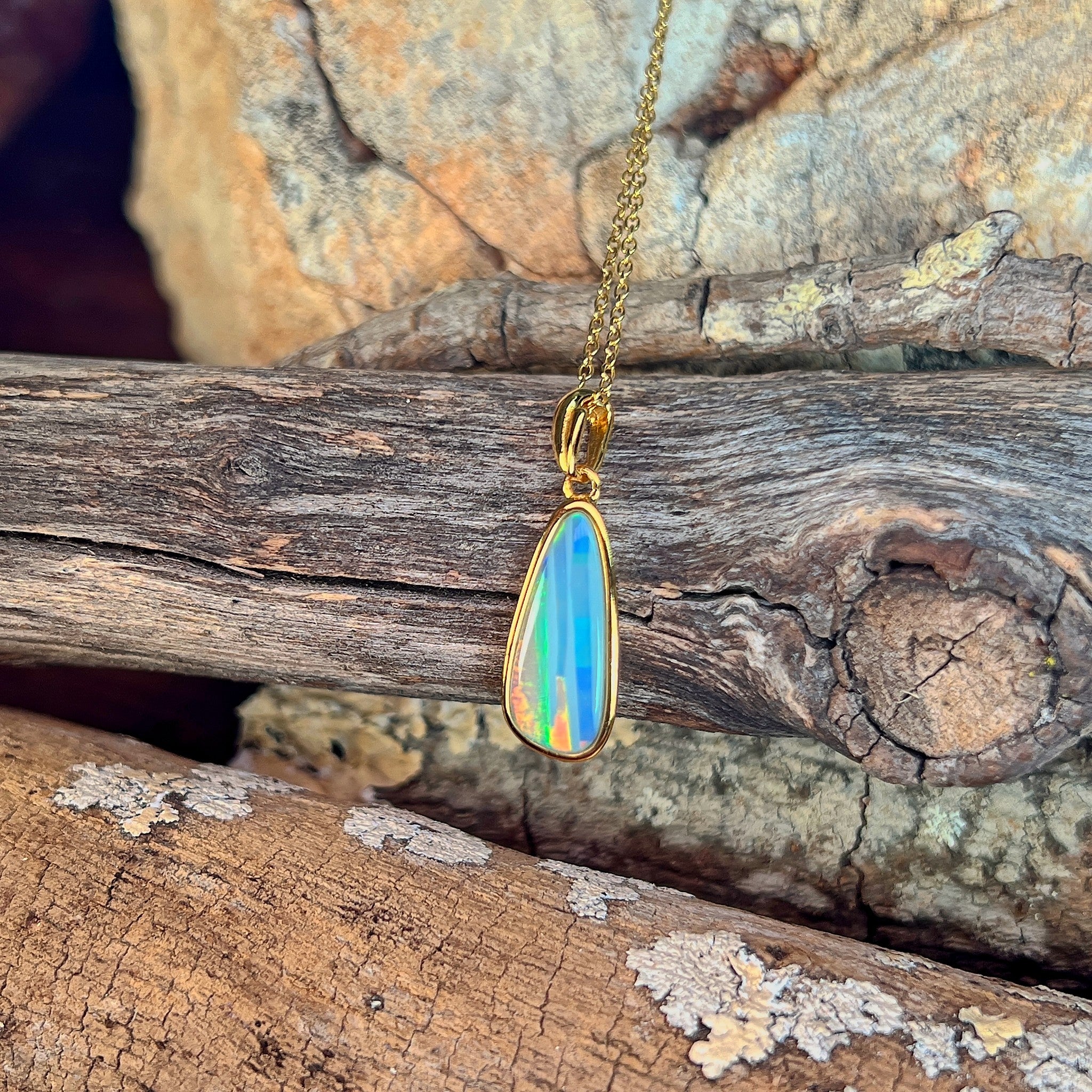 17 x 6mm Australian opal doublet pendant in yellow gold-plated silver, green, blue, red and yellow