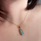 Australian opal doublet pendant worn at the neck, yellow gold-plated silver, 17 x 6mm pear-shaped stone