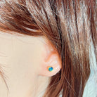round Australian opal doublet earrings in yellow gold-plated silver, worn on the ear