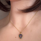Australian opal triplet pendant worn at the neck, yellow gold-plated silver, 12 x 8mm freeform stone