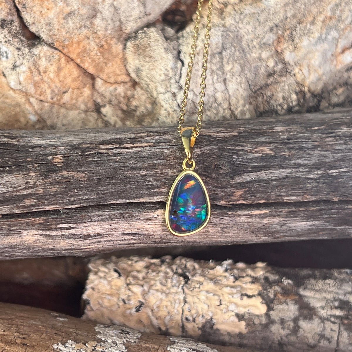 freeform Australian opal triplet pendant in yellow gold-plated silver, 11 x 8mm, red, green and blue