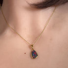 Australian opal triplet pendant worn at the neck, yellow gold-plated silver, 11 x 8mm freeform stone