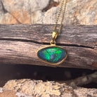 blue and green play-of-colour in a 16 x 10mm freeform Australian opal triplet pendant