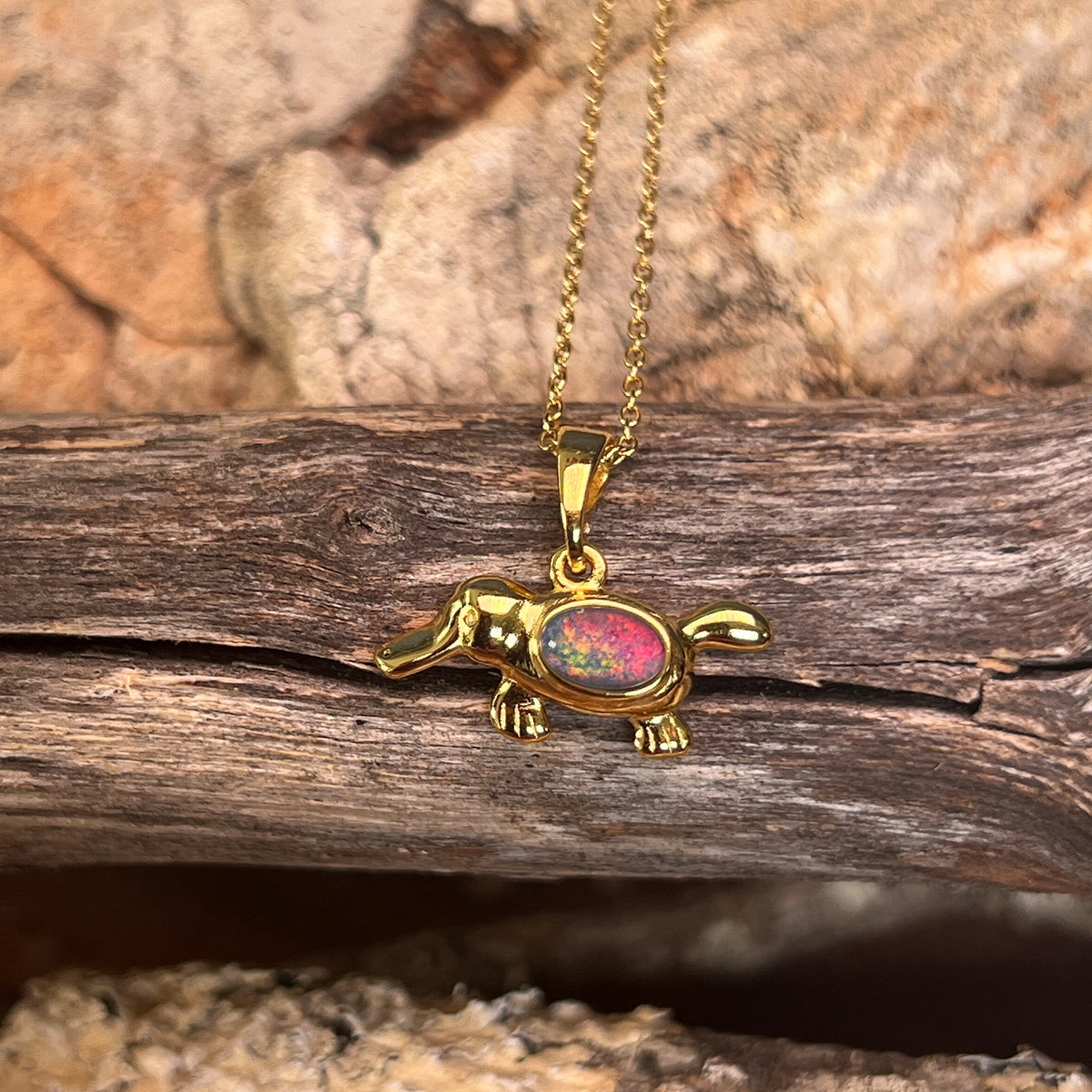 oval Australian opal triplet pendant in yellow gold-plated silver, blue, red and green play-of-colour