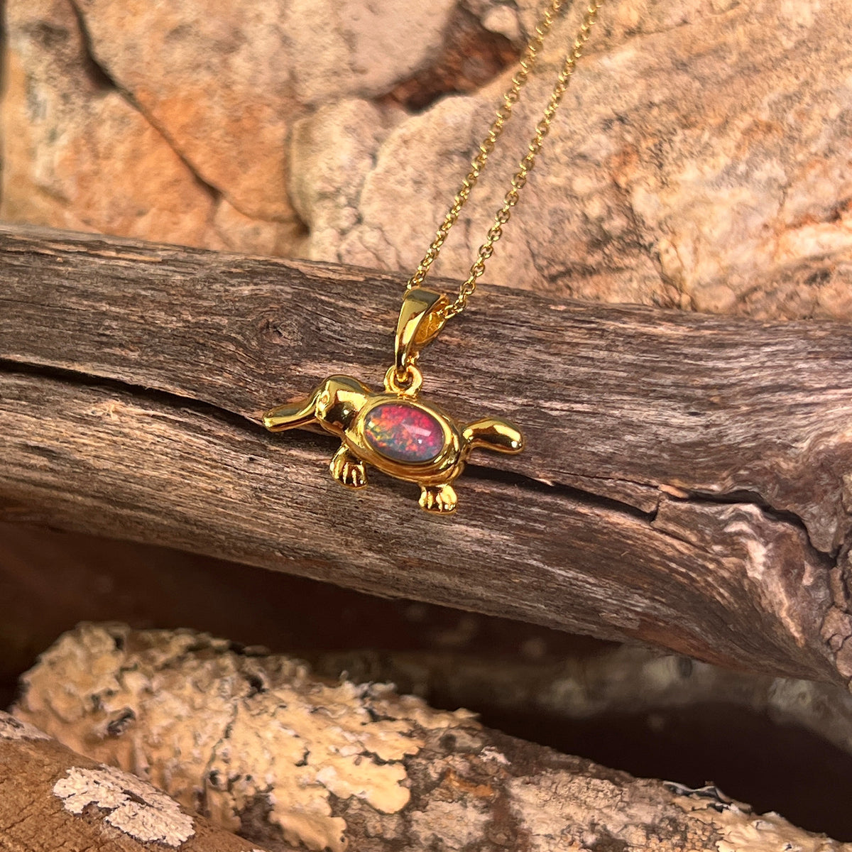 blue, red and green play-of-colour in a 6 x 4mm oval Australian opal triplet pendant