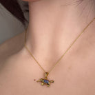 Australian opal triplet pendant worn at the neck, blue, red and green play-of-colour