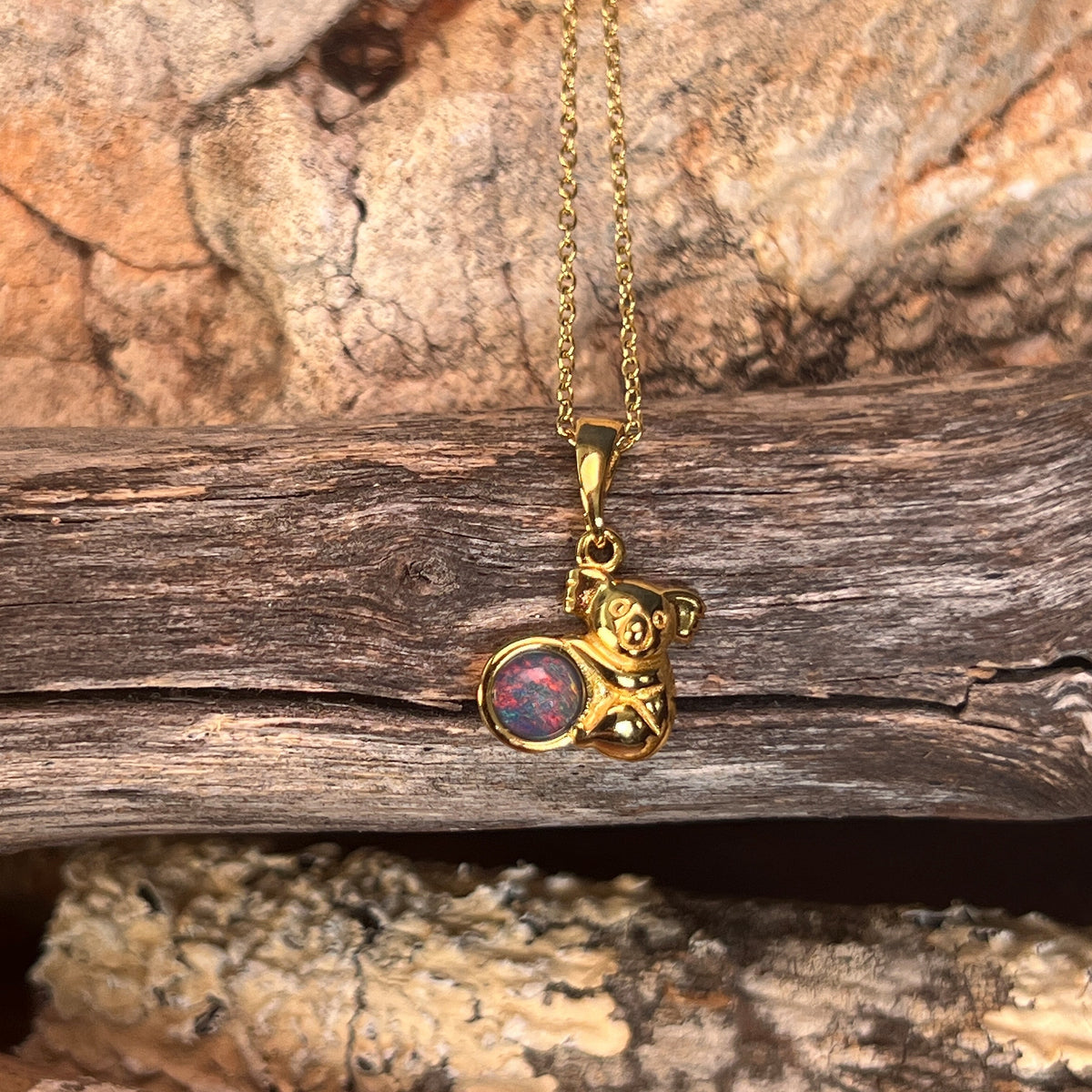 5mm Australian opal triplet pendant in yellow gold-plated silver, blue, red and green
