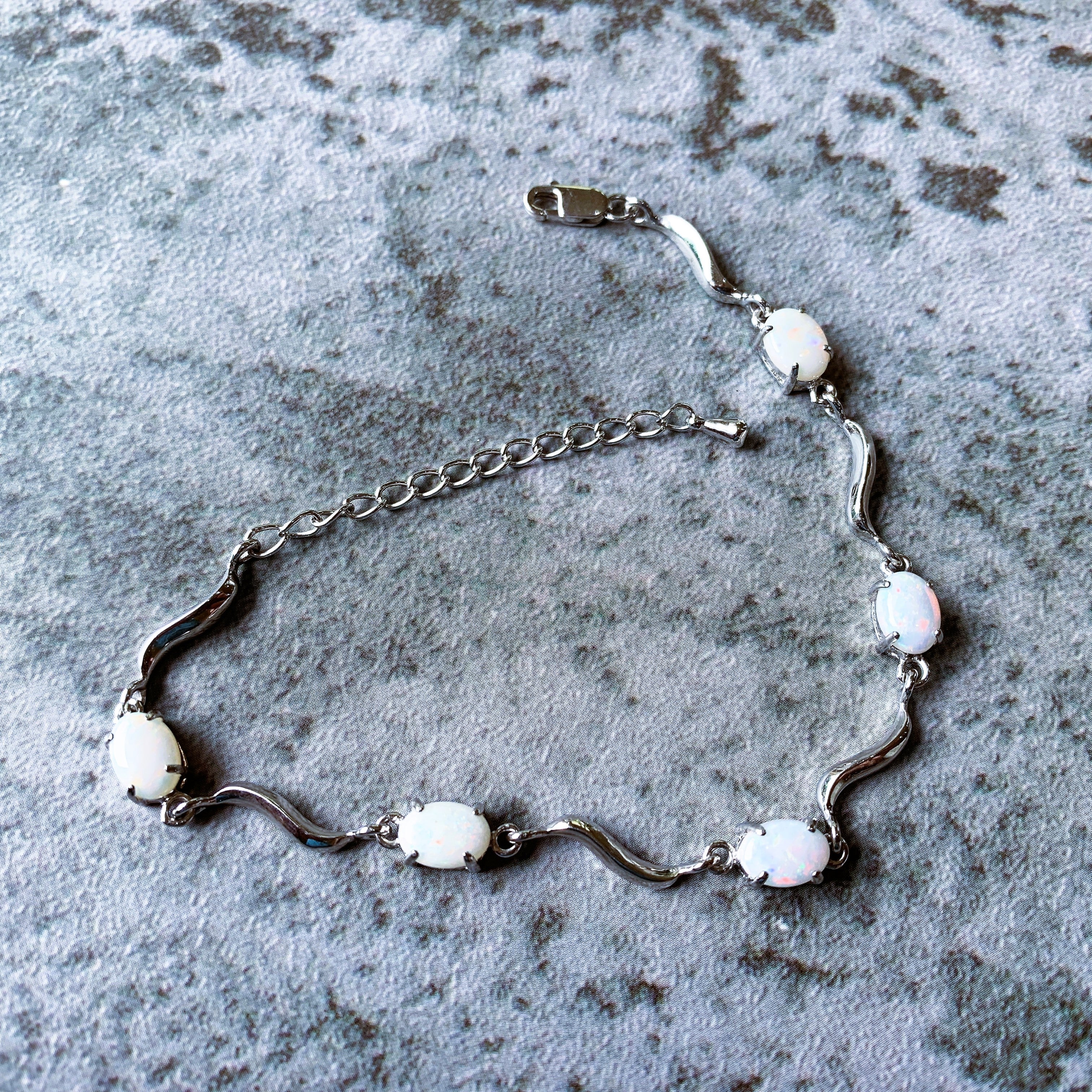 Sterling Silver wave 8x6mm Oval White Opal bracelet - Masterpiece Jewellery Opal & Gems Sydney Australia | Online Shop